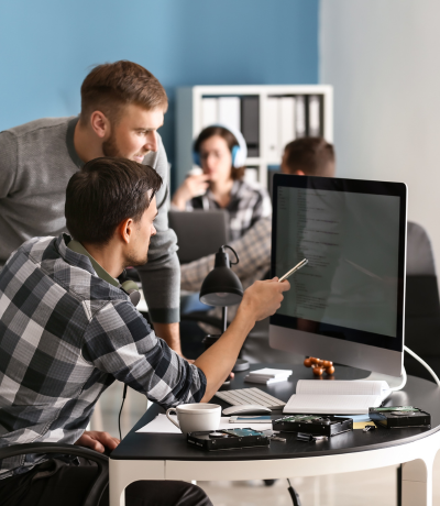 Two men working together in a computer