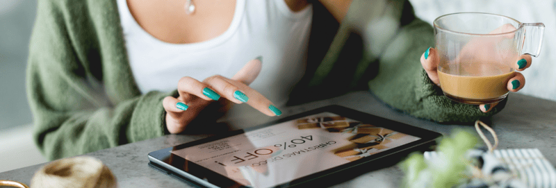 Close up image of a woman browsing her Ipad for Black Friday shopping