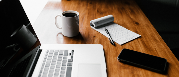 Computer, coffee and notes